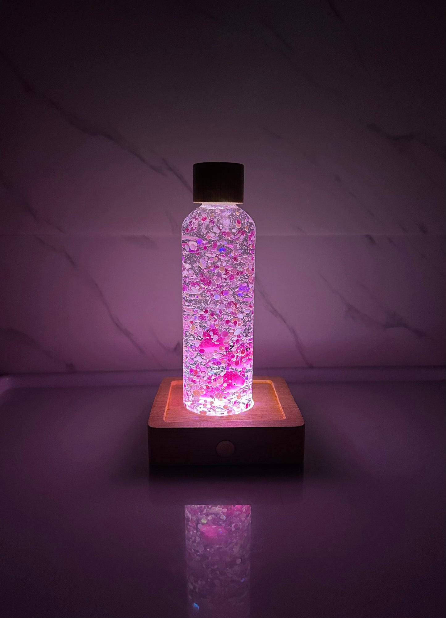 Socle lumineux pour bouteille sensorielle